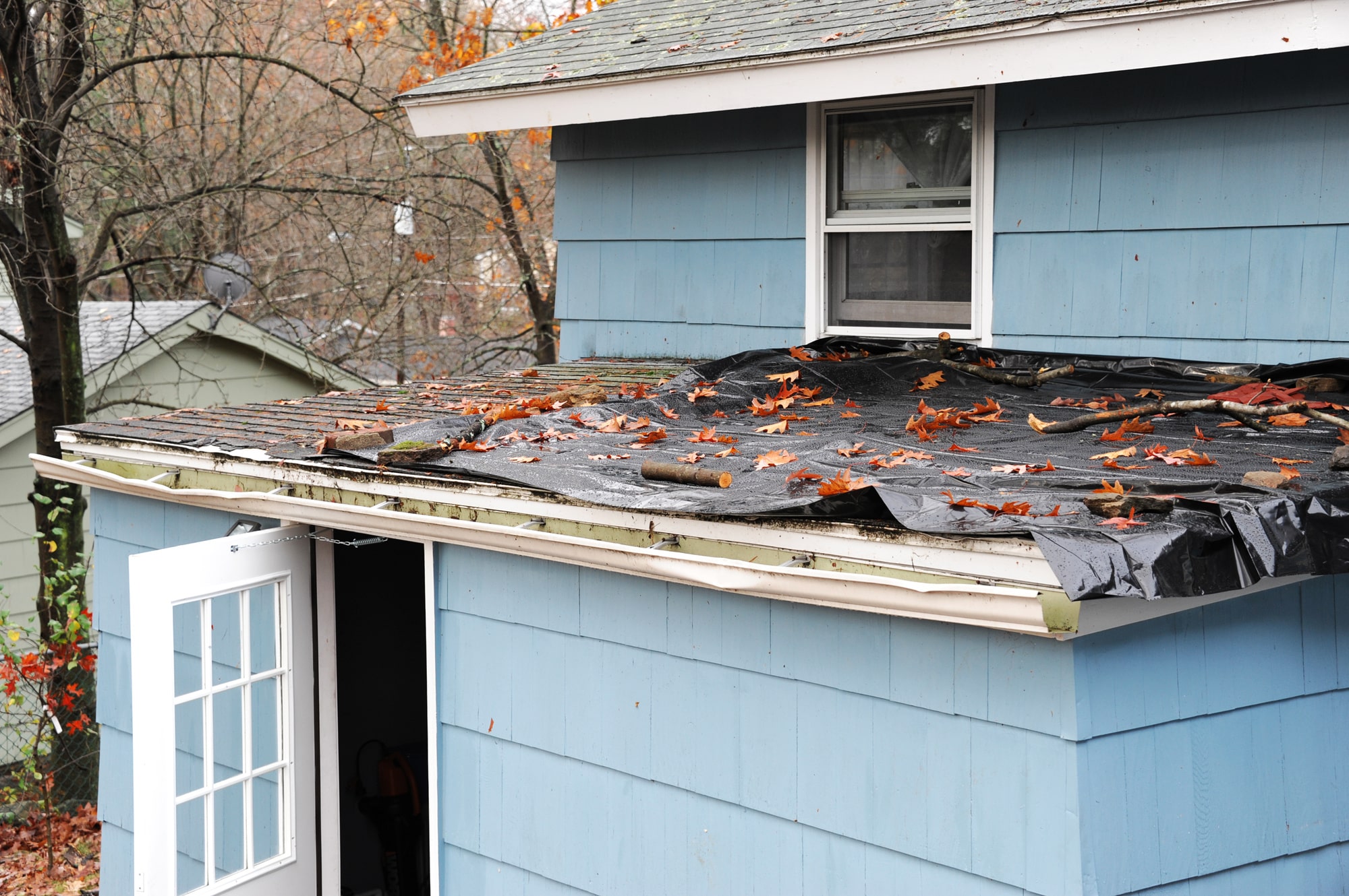 house roof damaged in storm